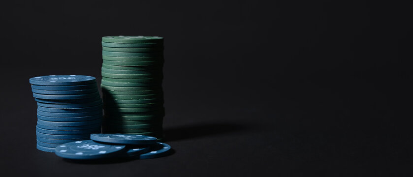 Poker chips on dark background