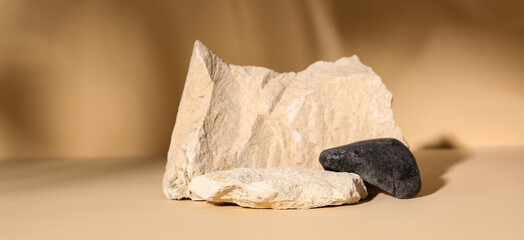 Decorative stone podiums on pale orange background