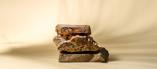 Decorative stone podiums on beige background