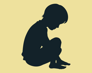 Silhouette of thoughtful child hugging knees, depicting sadness and contemplation