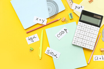 Calculator, school stationery, different math formulas and equations on yellow background