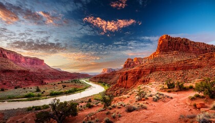 sinuous path of a parched riverbed weaving its way amidst fiery red canyons and bursts of desert flora encapsulates very soul of arizona arid terrain
