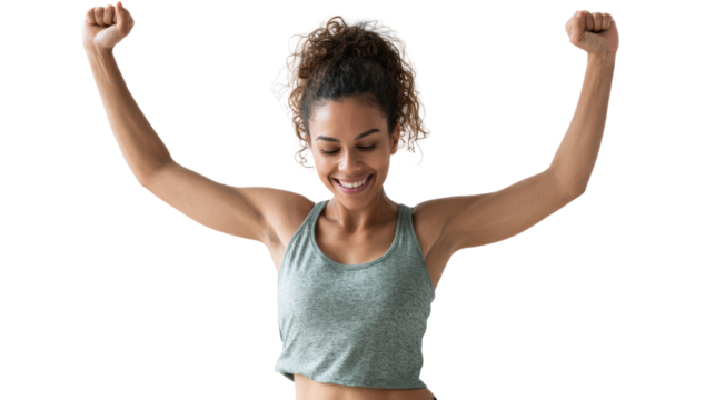 A joyful woman celebrating her fitness success with arms raised in victory against a white isolated background. - Powered by Adobe