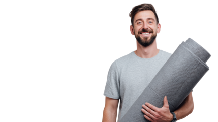 Smiling man holding a yoga mat, wearing a casual gray t-shirt, cheerful and ready for an active day.