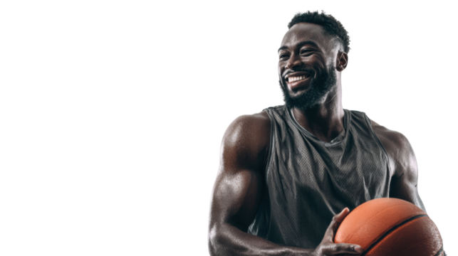 Smiling male basketball player holding a ball, focused on training and fitness.