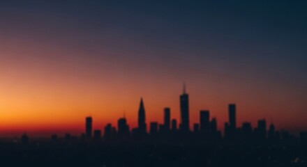 Silhouetted cityscape skyline with vibrant sunset glow, perfect as a blurred background for urban design