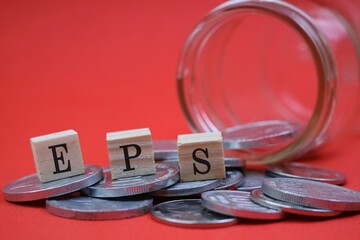 EPS Blocks on Coins with Jar Against a Vibrant Red Background
