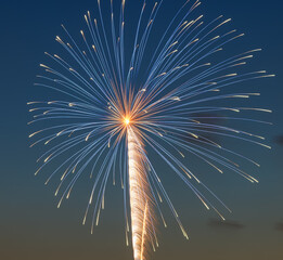 Brilliant blue and golden firework streaks illuminate the night sky, creating a radiant burst of light. Perfect for New Year&rsquo;s Eve, Independence Day, and holiday celebrations with festive pyrotechnics