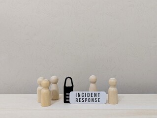 Cybersecurity incident response concept with wooden human figures and a padlock symbolizing data protection, team coordination, and digital security management against cyber threats and network breach