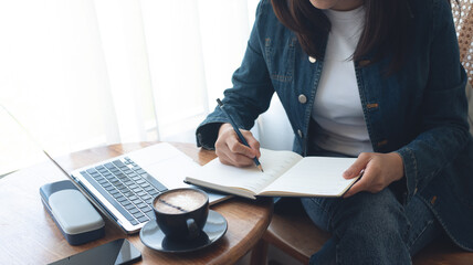 Business woman planning daily appointment and writing on business calendar planner notebook at office. event planning, Planner plan schedule calendar and reminder agenda