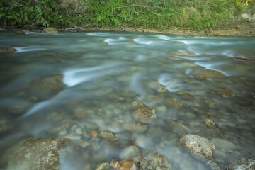 Softly Flowing Clarity: The River's Allure via Long Exposure