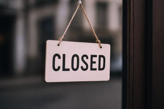 Closed sign conveys business unavailability message and concept with clear visual theme and idea