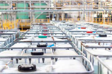 Industrial IBC Tanks in a Chemical Plant Warehouse