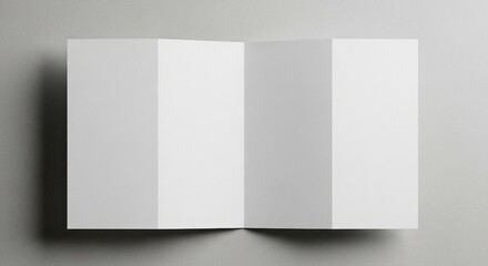 A pristine white paper brochure, unfolded to reveal four panels, lies flat on a neutral background, providing a clean and versatile template