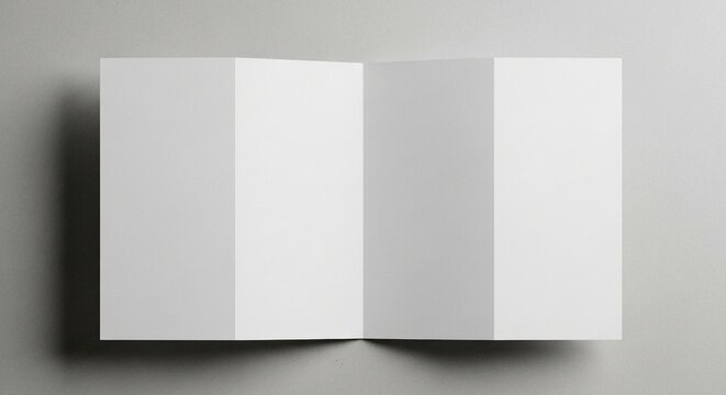 A pristine white paper brochure, unfolded to reveal four panels, lies flat on a neutral background, providing a clean and versatile template
