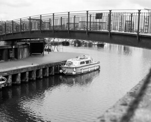 Vintage photo of canal boat moored under a bridge