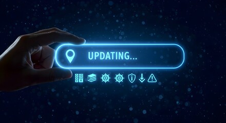 Futuristic digital interface showing "UPDATING..." with a glowing blue button, symbolizing technological progress.