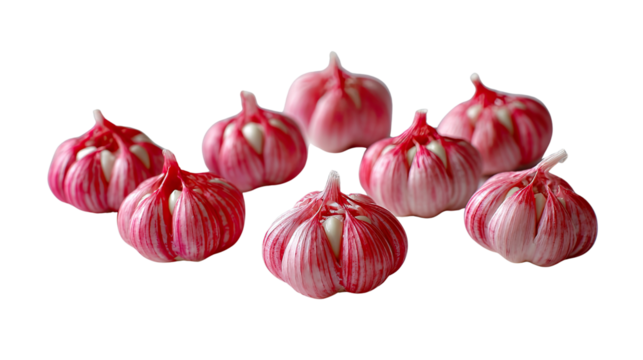 Vibrant Garlic: A close-up shot of several bulb of garlic with striking red hues. These healthy bulbs are ready to infuse dishes with their aromatic and pungent essence.