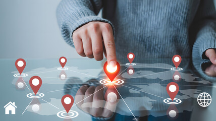 Intuitive digital map interface with glowing location pins and network connections, a hand interacting with global data points for navigation and strategy
