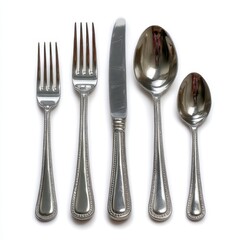 Ornate silverware set with intricate detailing isolated on white background