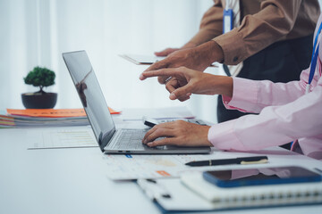 Businessman team working at office with document on his desk, doing planning analyzing the financial report, business plan investment, finance analysis concept. Economic business discussions.
