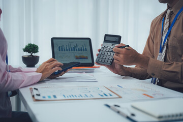 Businessman team working at office with document on his desk, doing planning analyzing the financial report, business plan investment, finance analysis concept. Economic business discussions.

