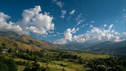 Fototapeta premium Vast Mountain Valley Landscape Under a Sunny Blue Sky