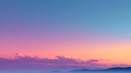 Soft Pink and Orange Sunset Sky Over a Distant Mountain Range