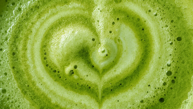 Green Tea Matcha Latte with Beautiful Foam Art. Close-up of Matcha Latte background.