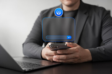 AI chatbot concept showing businessman using smartphone with virtual assistant app interface, digital communication, automation, smart technology, and innovative business solution.