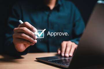 Person approves a document or task with a digital checkmark on a screen