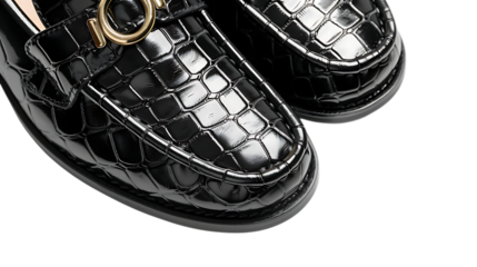 A closeup of stylish black crocodile leather loafers isolated on transparent background, showcasing a trendy and fashionable footwear choice for a modern wardrobe