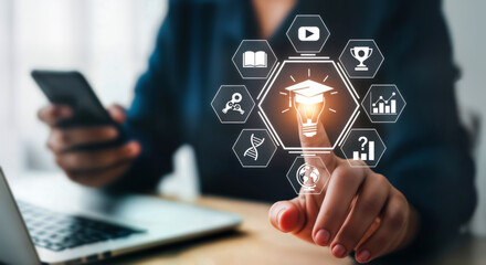 Person interacting with a digital interface displaying educational icons and a graduation cap, symbolizing online learning, skill development, and career advancement