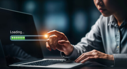 A persons hand interacting with a laptop screen displaying a loading progress bar, symbolizing technology, data transfer, and online processes