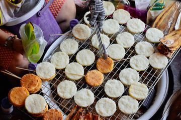 Grilled sticky rice with egg plating on stove. Select and soft focus.