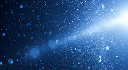 Obraz premium Abstract blue sparkling light background with bokeh effect and lens flare