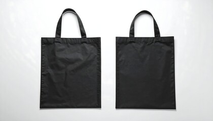 Flat lay mockup of a plain black tote bag, representing stylish eco-friendly branding.