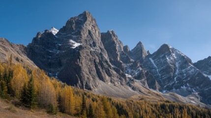 Fototapeta premium Spectacular Alpine Scenery with Towering Mountains and Golden Larch Trees