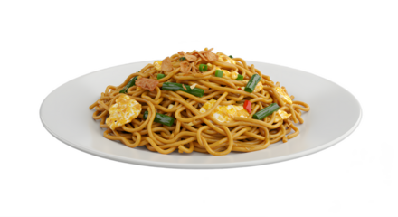Delicious mie goreng noodles plate with egg and fresh green vegetables