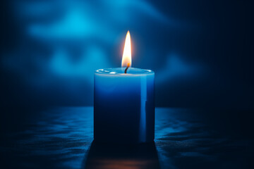 Blue candles lit separately on a dark blue background.