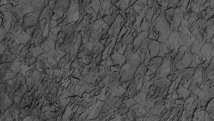 Naklejka premium A rough textured, dark grey stone used for outdoor flooring