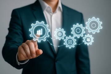 Business professional touching glowing gears with icons suit teal