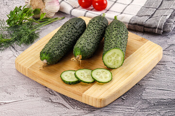 Raw green cucumbers with slices