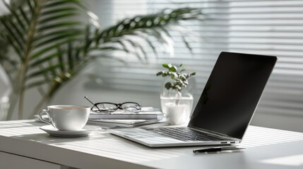 modern minimalist workspace, sleek laptop on white desk, coffee cup and saucer, eyeglasses and notepad neatly arranged, small green plant, soft natural lighting through window blinds