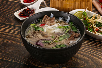 Vietnamese Pho Bo soup with beef and noodles