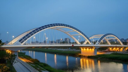 Fototapeta premium This image features a modern bridge with a solar panel arch and elegant lighting, spanning a river at dusk, symbolizing sustainable urban infrastructure and smart city design.