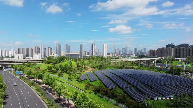 Green city, energy city, solar panels, and distant city skyline