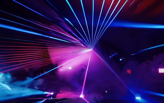 Looping colorful disco light beams rotating in foggy black background