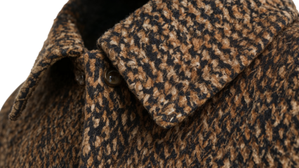 Closeup of tweed jacket collar with houndstooth pattern in brown and black wool fabric detail