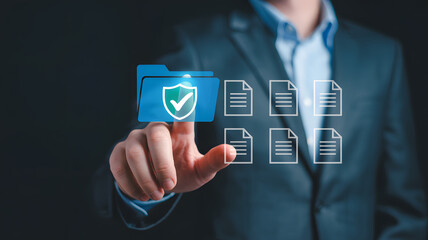 Businessman securing digital documents with data protection and cyber security concept